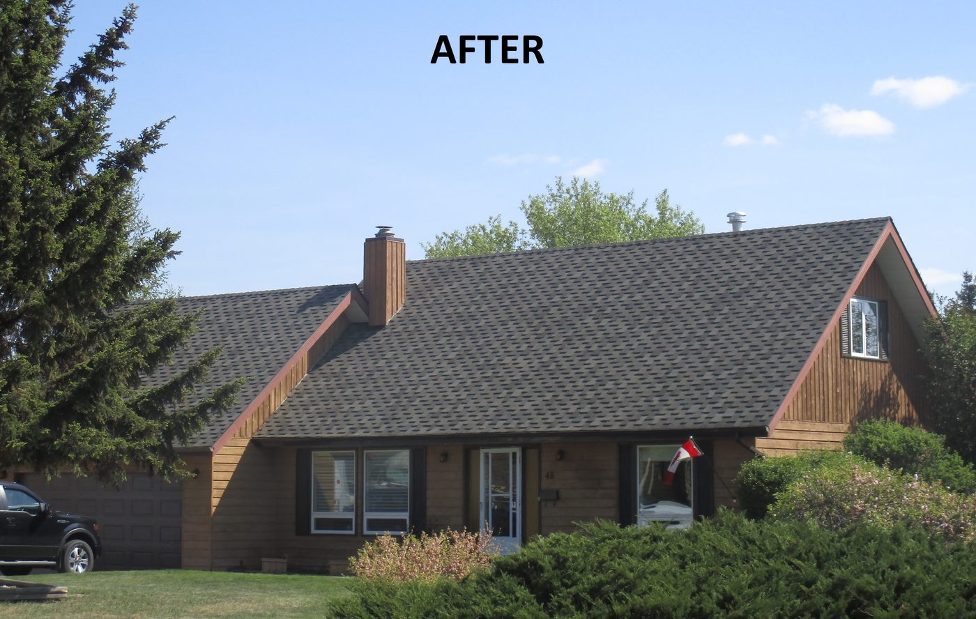 Home with a new dark shingle roof